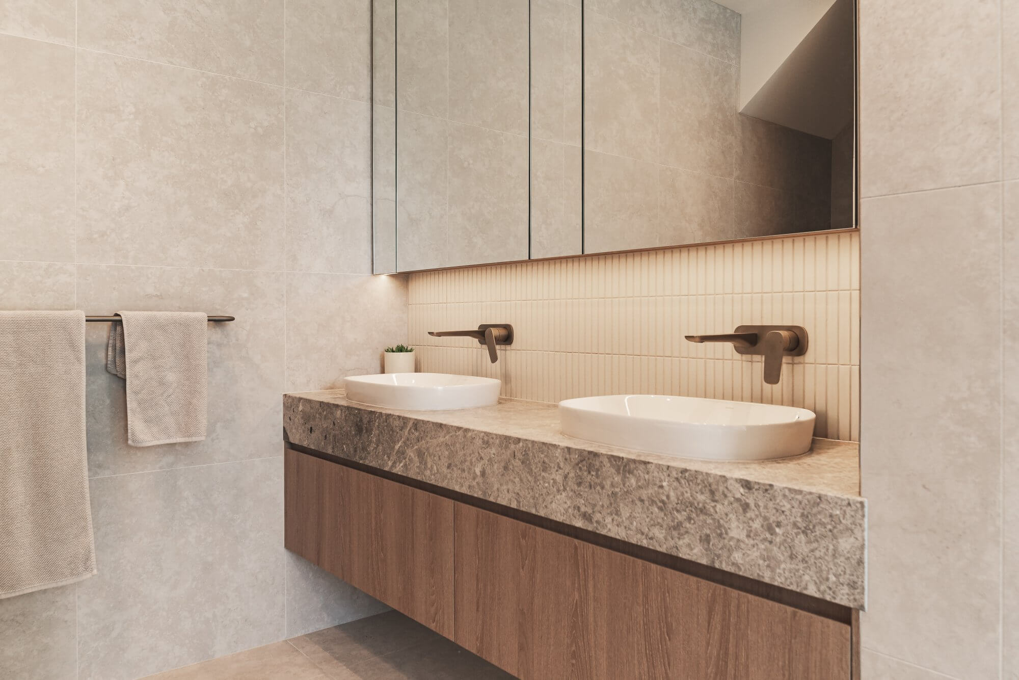 Bathroom with double vanity and stone benchtop